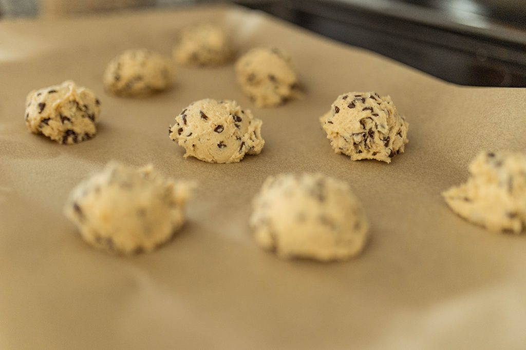Chocolate chip cookie dough on parchment paper