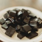 Activated Charcoal gummies on plate