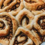 Apple Cinnamon rolls on parchment paper