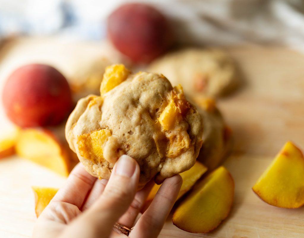 sourdough peach cookie in hand