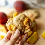sourdough peach cookie in hand